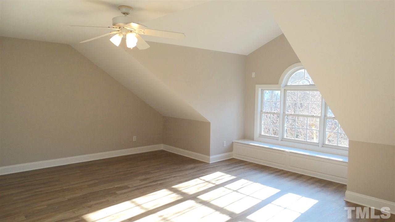 10404 Veasey Mill Road Raleigh, NC 27615 - Photo 17 of 30 wooden floor in an empty room with a window