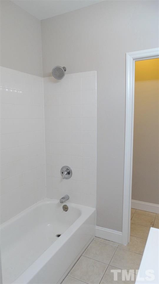 10404 Veasey Mill Road Raleigh, NC 27615 - Photo 24 of 30 a bathroom with a bathtub