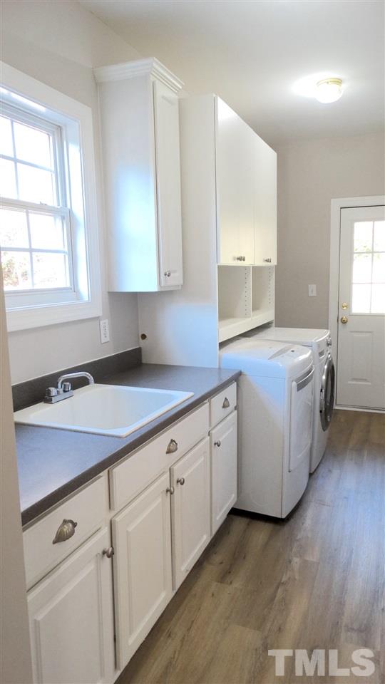 10404 Veasey Mill Road Raleigh, NC 27615 - Photo 25 of 30 a kitchen with sink cabinets and window