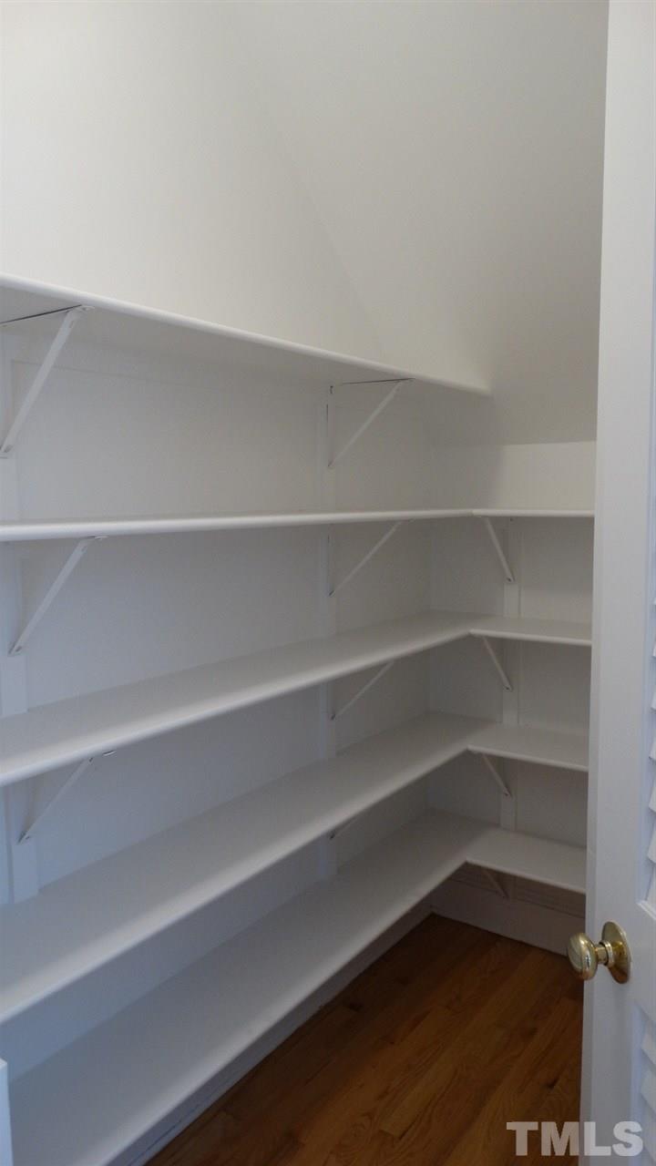 10404 Veasey Mill Road Raleigh, NC 27615 - Photo 27 of 30 a view of walk in closet with empty racks