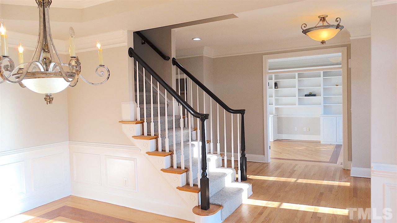10404 Veasey Mill Road Raleigh, NC 27615 - Photo 9 of 30 a view of entryway and hall with wooden floor