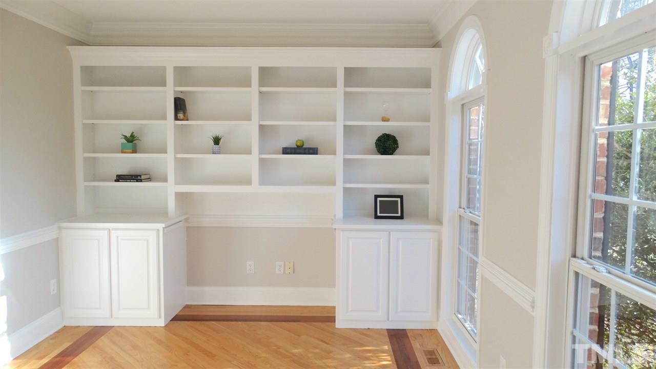 10404 Veasey Mill Road Raleigh, NC 27615 - Photo 10 of 30 a view of a bedroom with wooden floor and closet