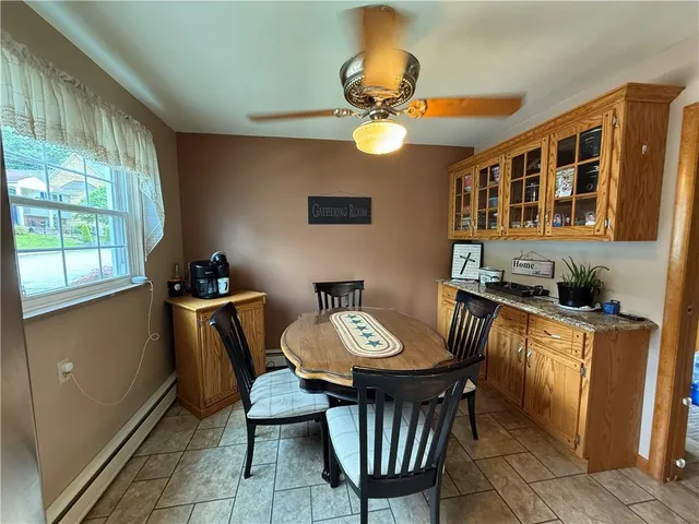 a view of a dining room with furniture window and outside view
