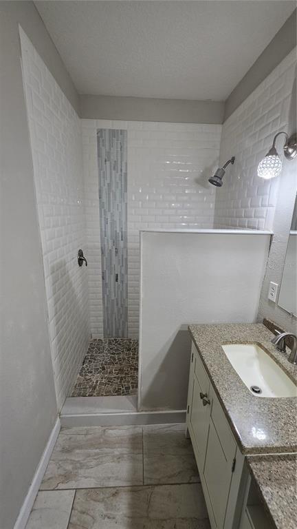 708 Fortanini Circle Ocoee, FL 34761 - Photo 13 of 32 a bathroom with a granite countertop sink a toilet and shower