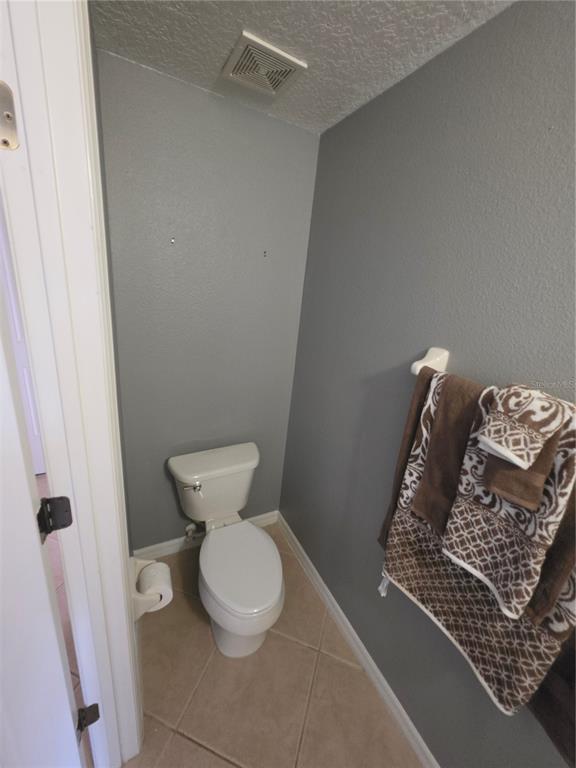 708 Fortanini Circle Ocoee, FL 34761 - Photo 17 of 32 a bathroom with a toilet
