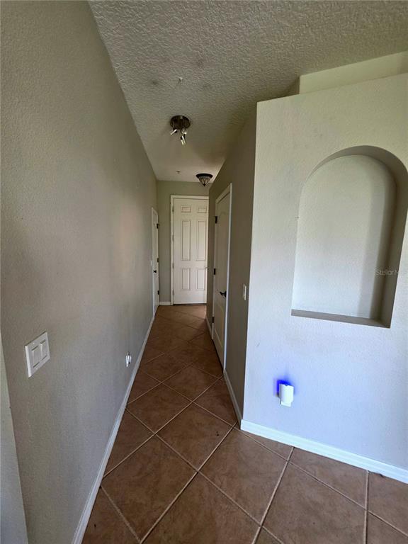 708 Fortanini Circle Ocoee, FL 34761 - Photo 20 of 32 a view of a hallway with wooden floor and entryway