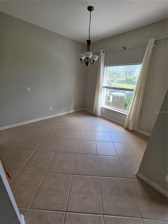 708 Fortanini Circle Ocoee, FL 34761 - Photo 21 of 32 a view of an empty room with a window