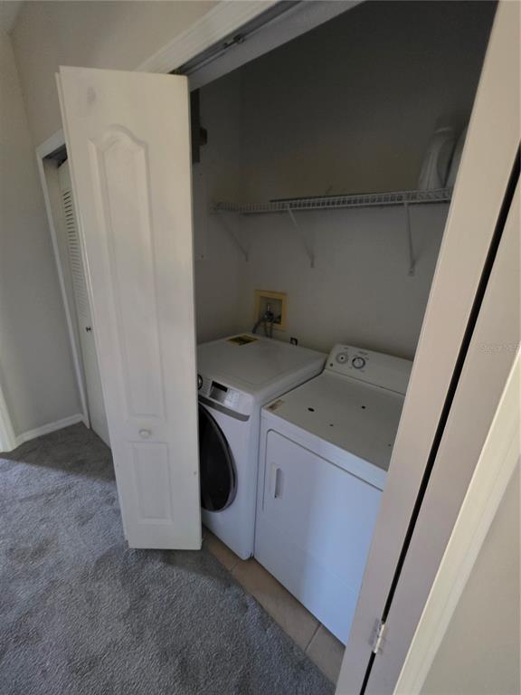 708 Fortanini Circle Ocoee, FL 34761 - Photo 30 of 32 a utility room with dryer and washer