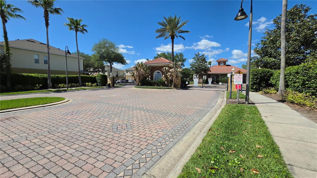 708 Fortanini Circle Ocoee, FL 34761 - Photo 4 of 32 a view of a garden with a building and palm trees