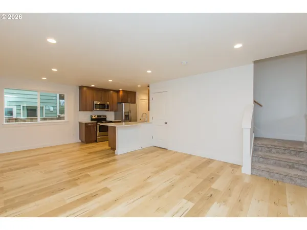 a view of kitchen with wooden floor