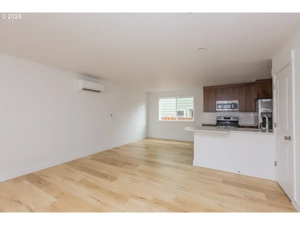 a view of kitchen with wooden floor