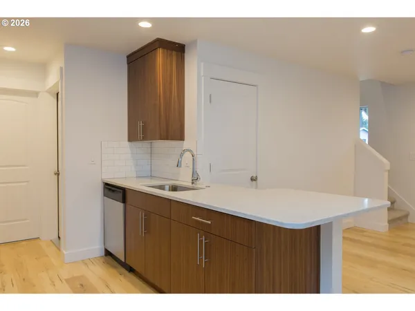 a bathroom with a sink vanity and a mirror