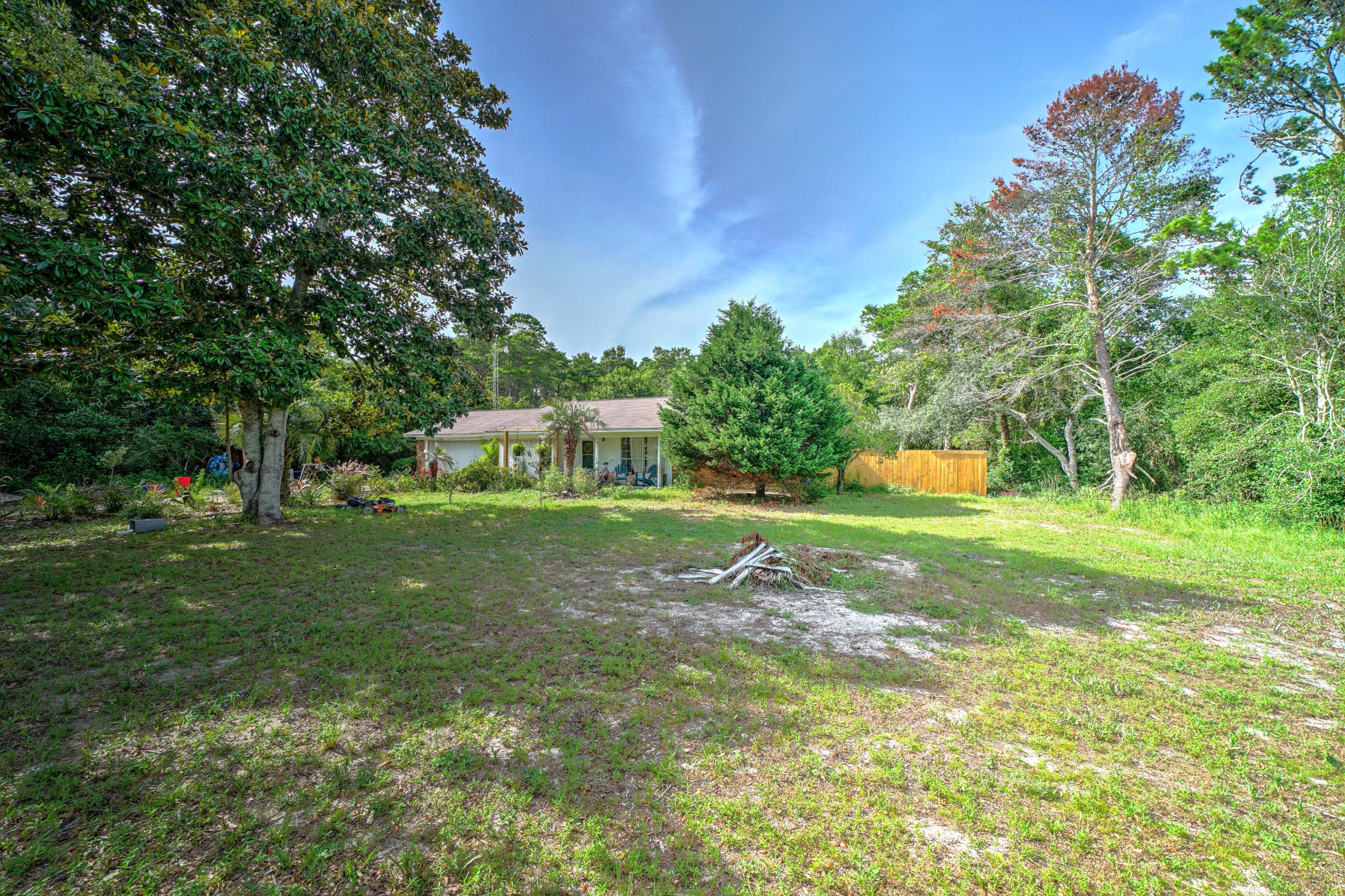 143 Walton Palm Road Inlet Beach, FL 32461 - Photo 8 of 10 a view of a house with a yard