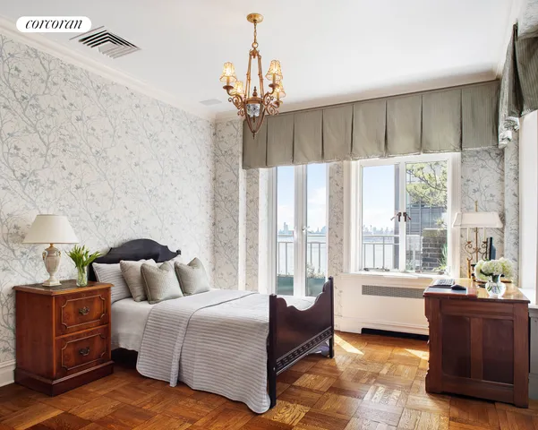 a bedroom with a bed and a couch