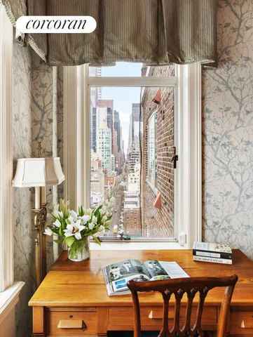 a view of a room with a table and chairs