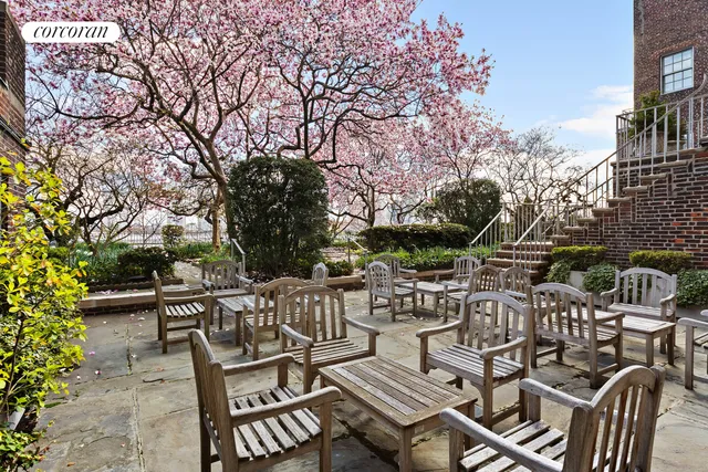 a view of a patio with iron fence