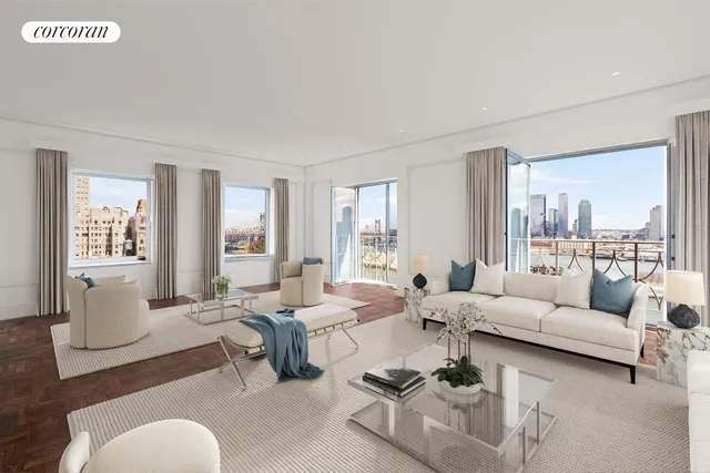 a living room with furniture large windows and wooden floor