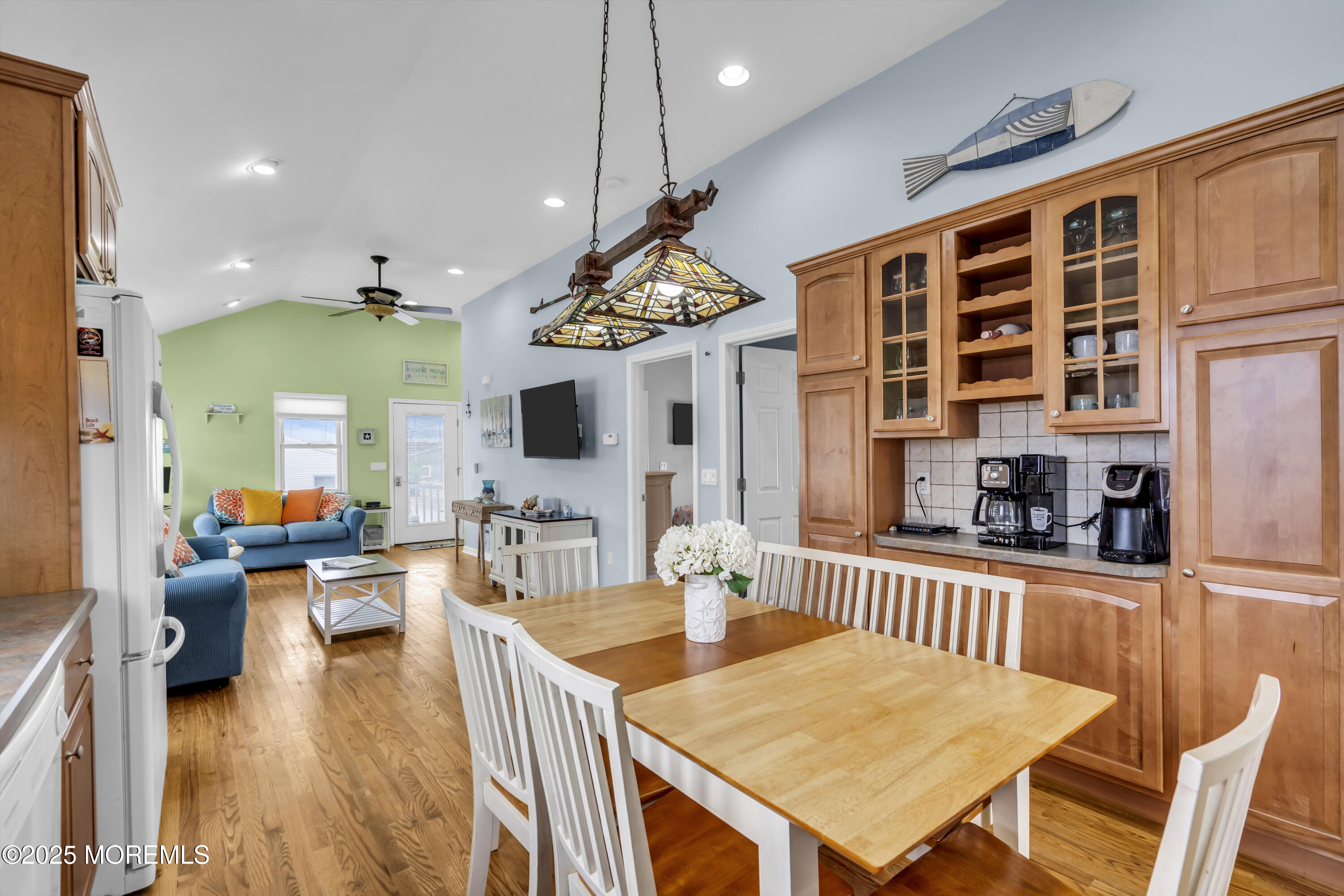 39 East Penguin Way Lavallette, NJ 08735 - Photo 14 of 29 a view of a dining room and livingroom with furniture wooden floor a chandelier