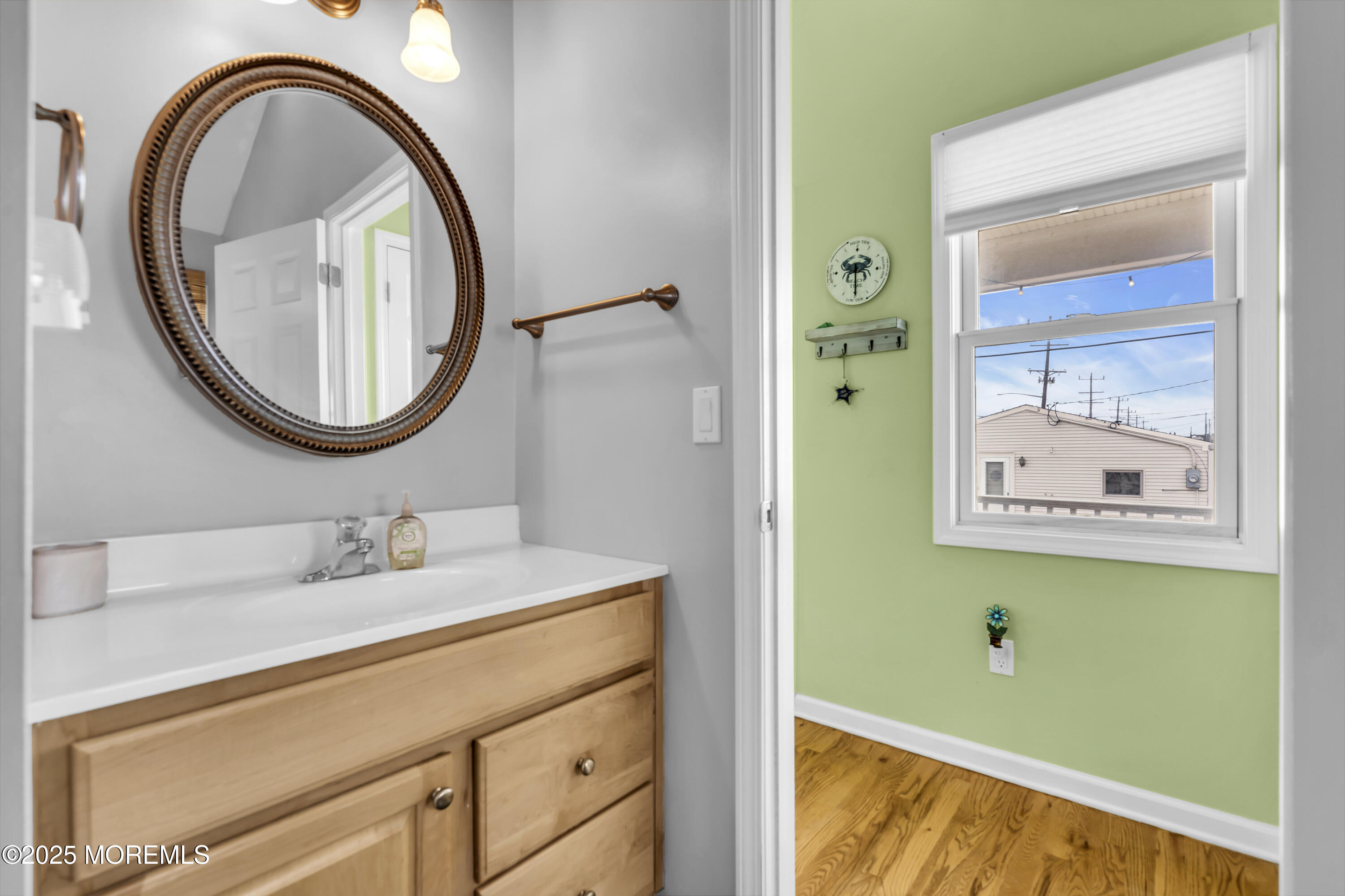 39 East Penguin Way Lavallette, NJ 08735 - Photo 19 of 29 a bathroom with a sink a toilet and a mirror