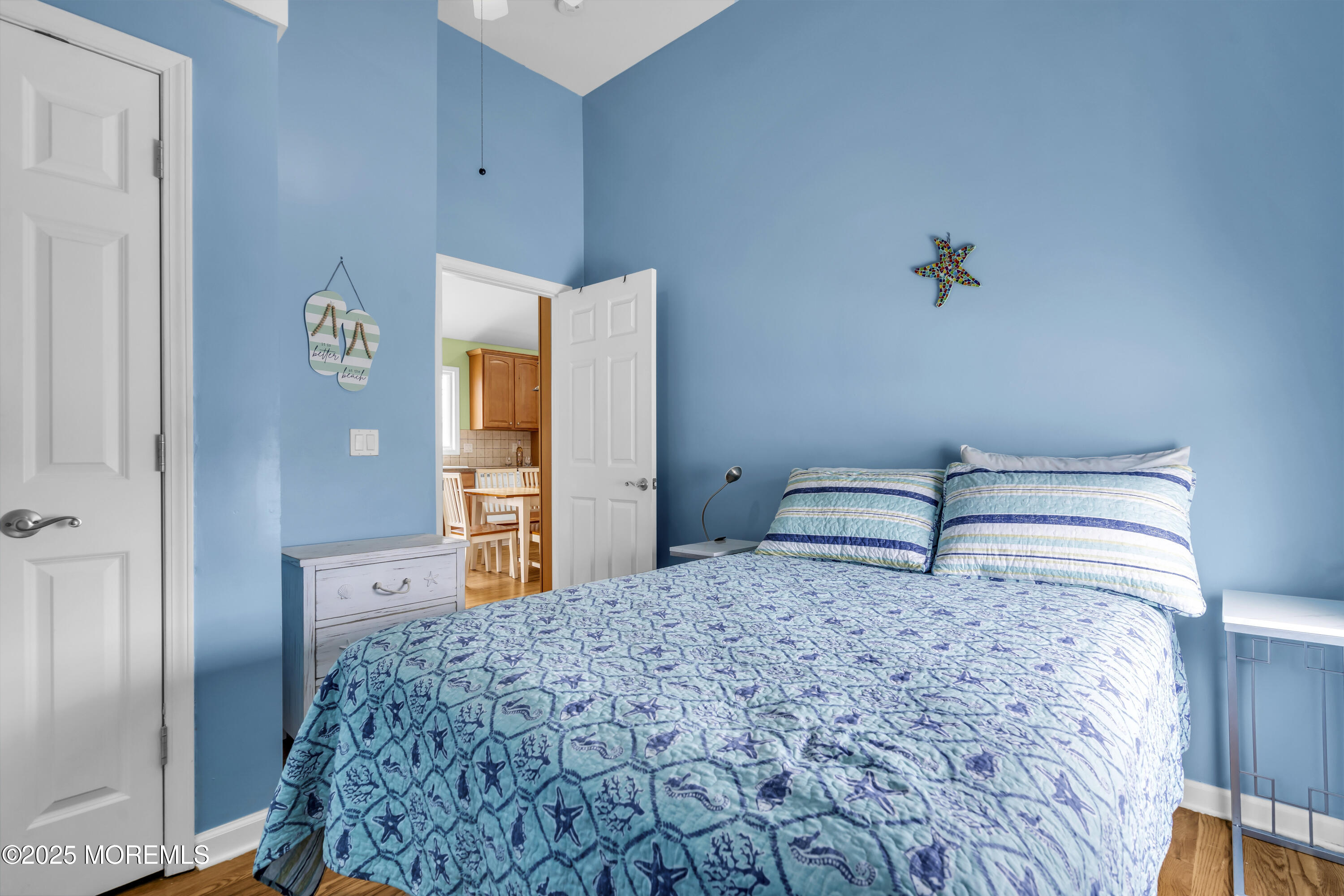 39 East Penguin Way Lavallette, NJ 08735 - Photo 20 of 29 a bedroom with a bed and a dresser