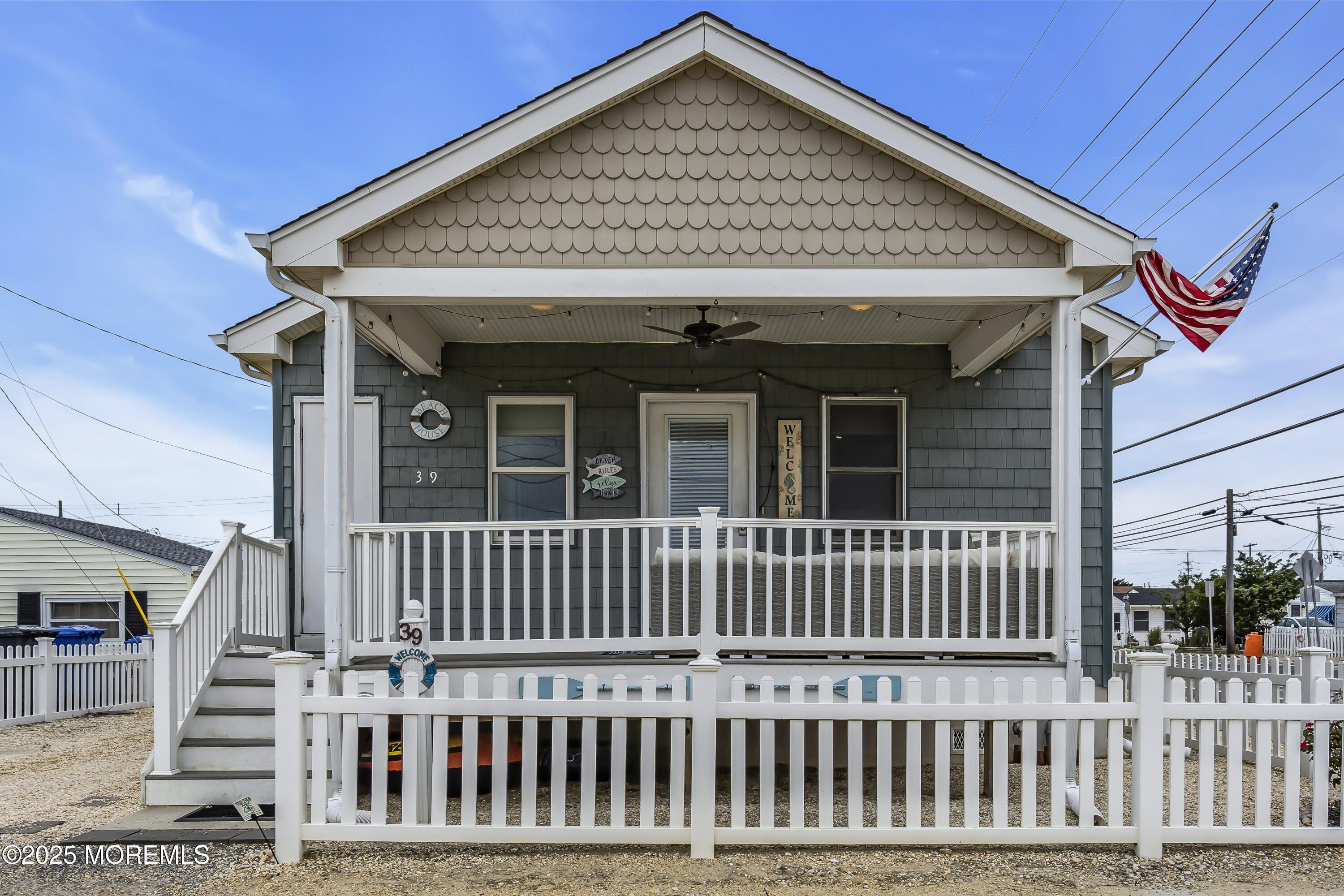 39 East Penguin Way Lavallette, NJ 08735 - Photo 2 of 29 a view of a house with wooden deck