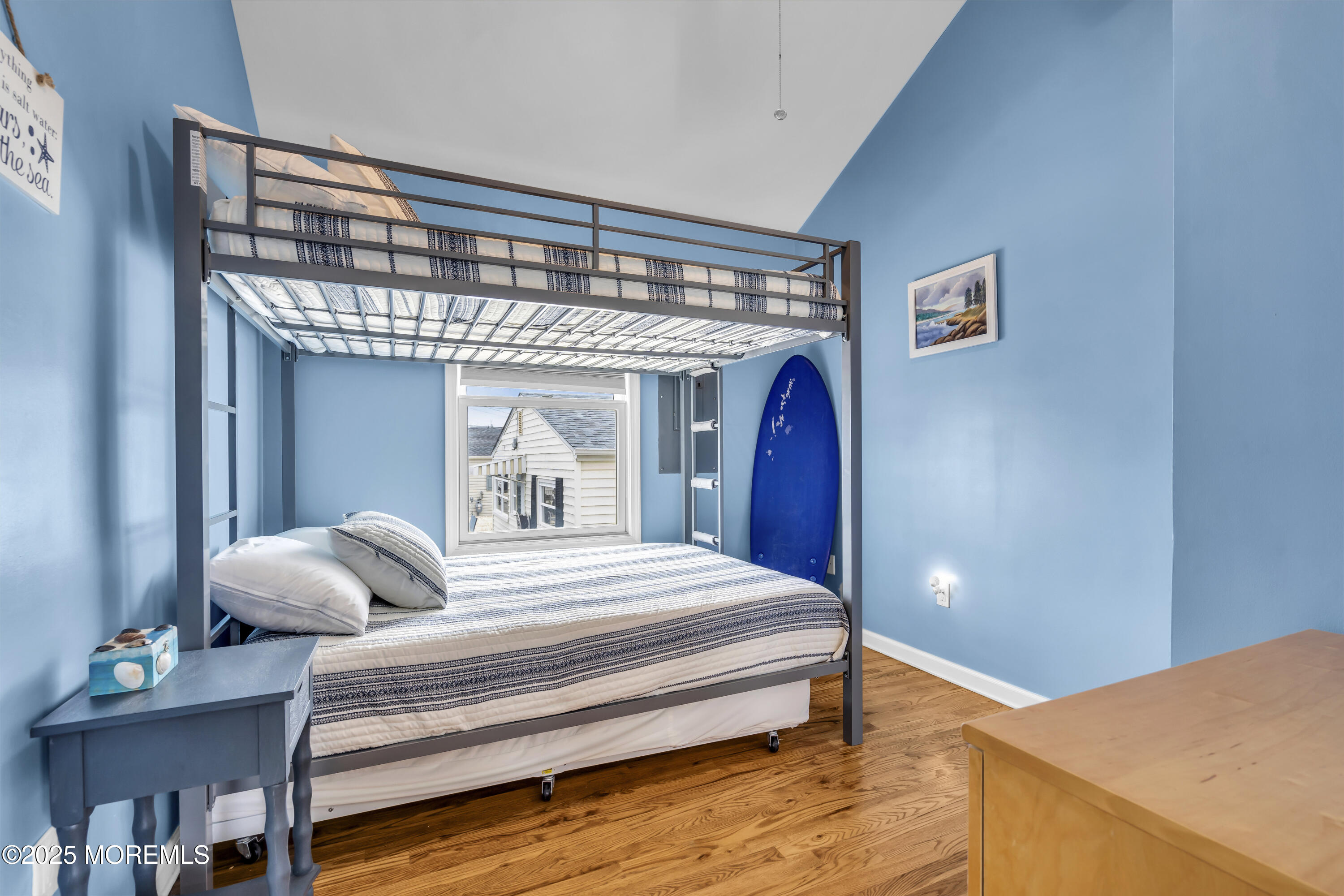 39 East Penguin Way Lavallette, NJ 08735 - Photo 21 of 29 a bedroom with a large bed and a chandelier