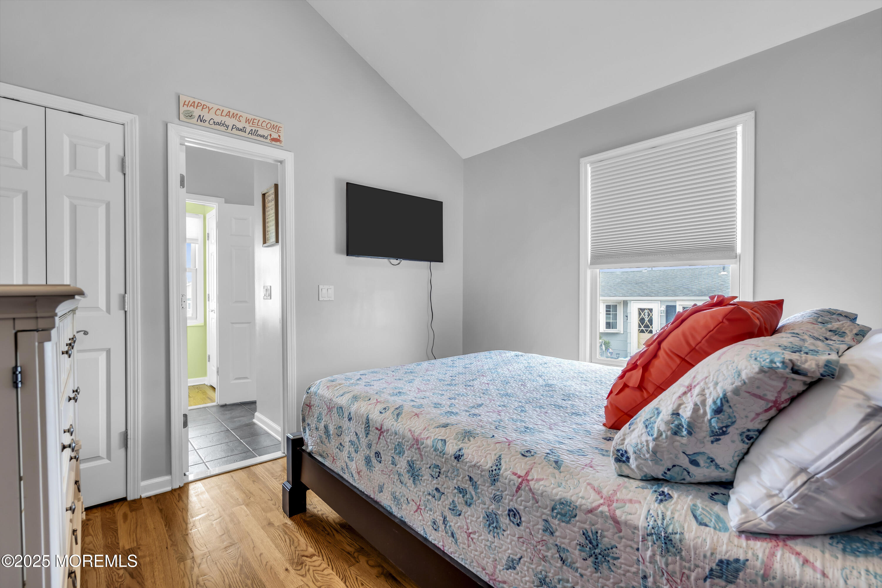 39 East Penguin Way Lavallette, NJ 08735 - Photo 23 of 29 a bedroom with a bed and a flat screen tv