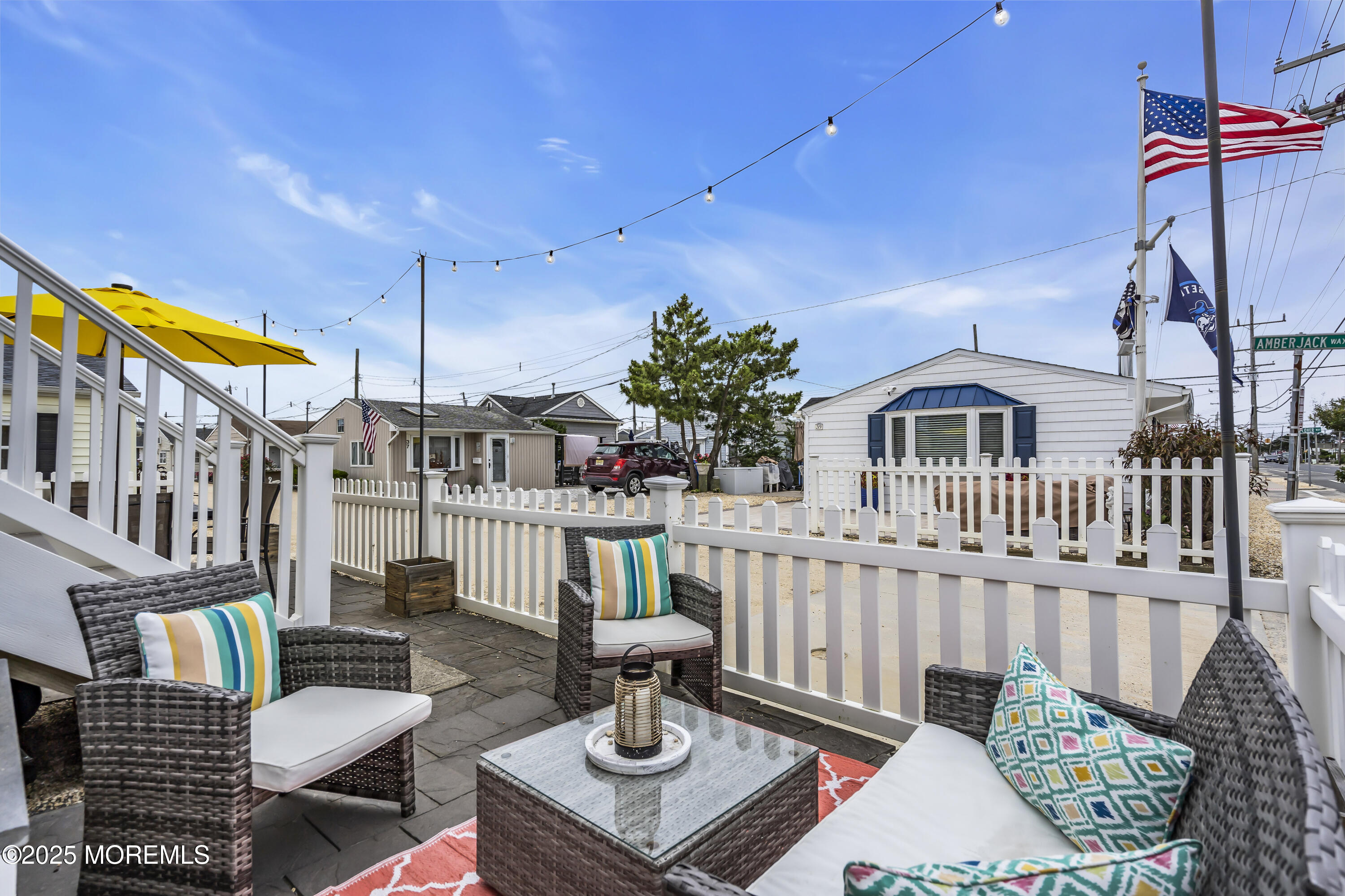 39 East Penguin Way Lavallette, NJ 08735 - Photo 26 of 29 a balcony with table and chairs