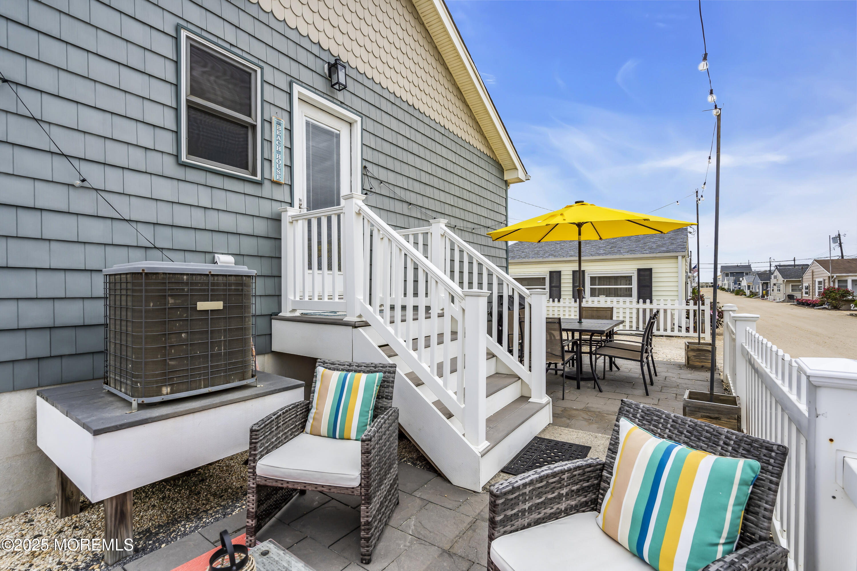 39 East Penguin Way Lavallette, NJ 08735 - Photo 27 of 29 a view of a patio with a table and chairs