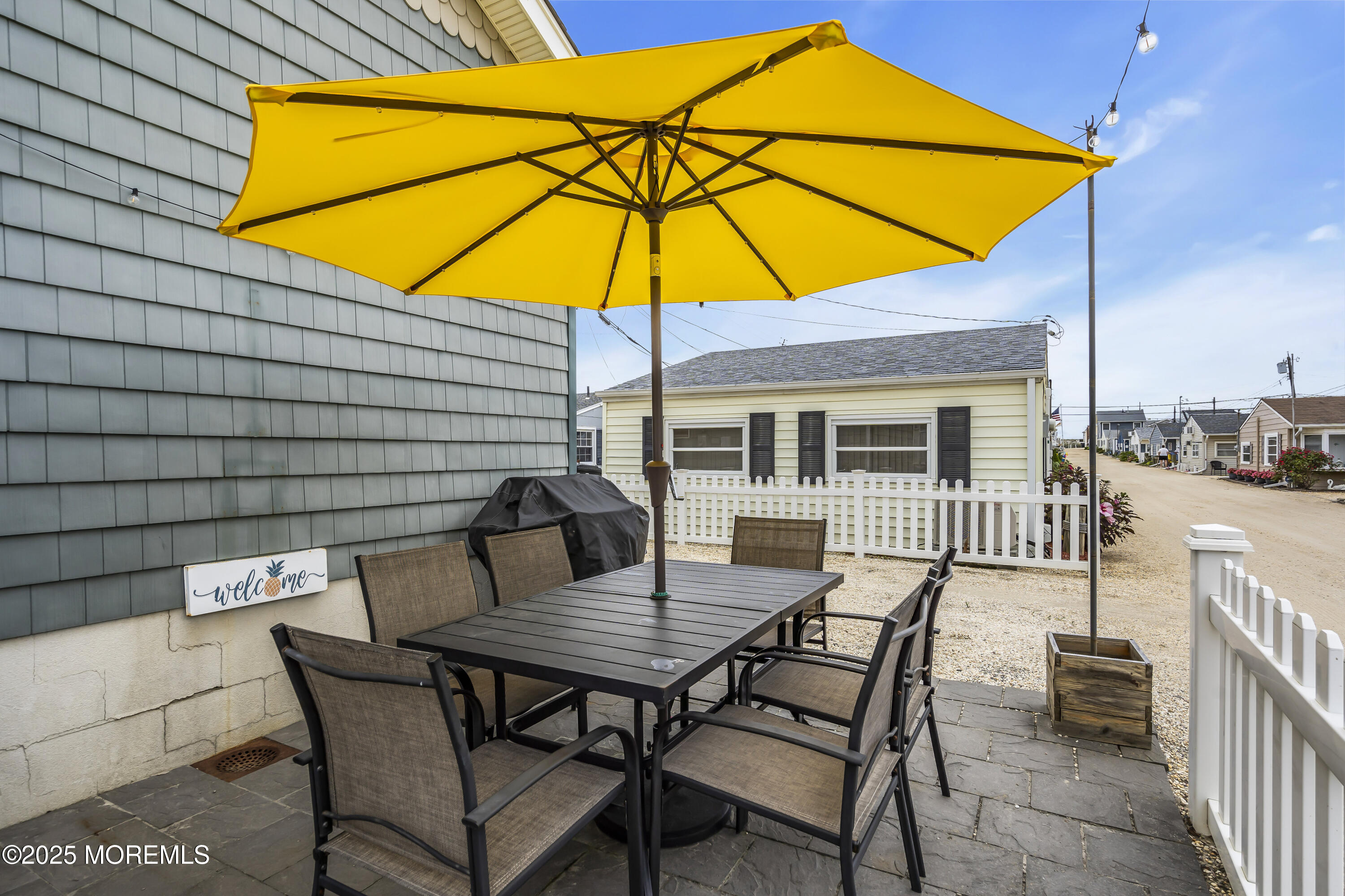 39 East Penguin Way Lavallette, NJ 08735 - Photo 28 of 29 a view of backyard of house with seating space