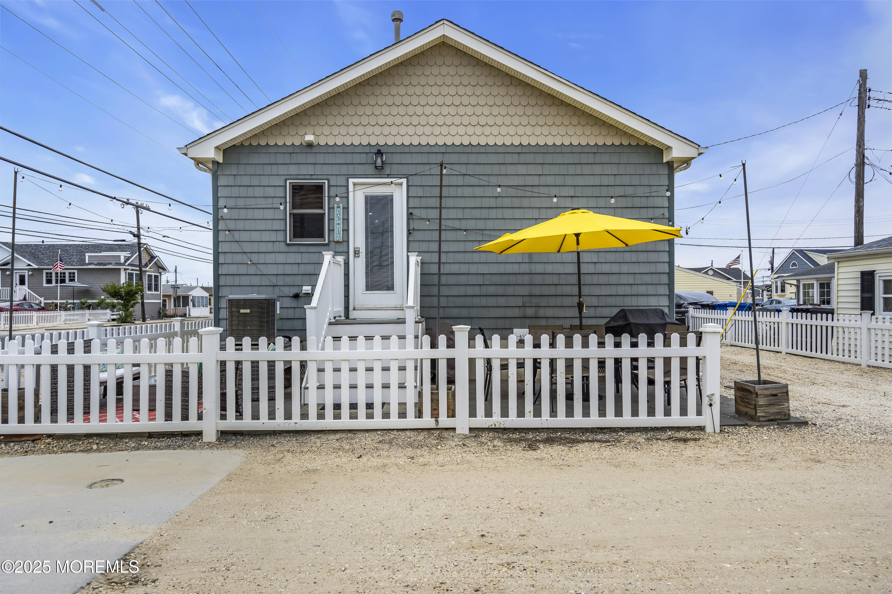 39 East Penguin Way Lavallette, NJ 08735 - Photo 29 of 29 a front view of a house with a garden