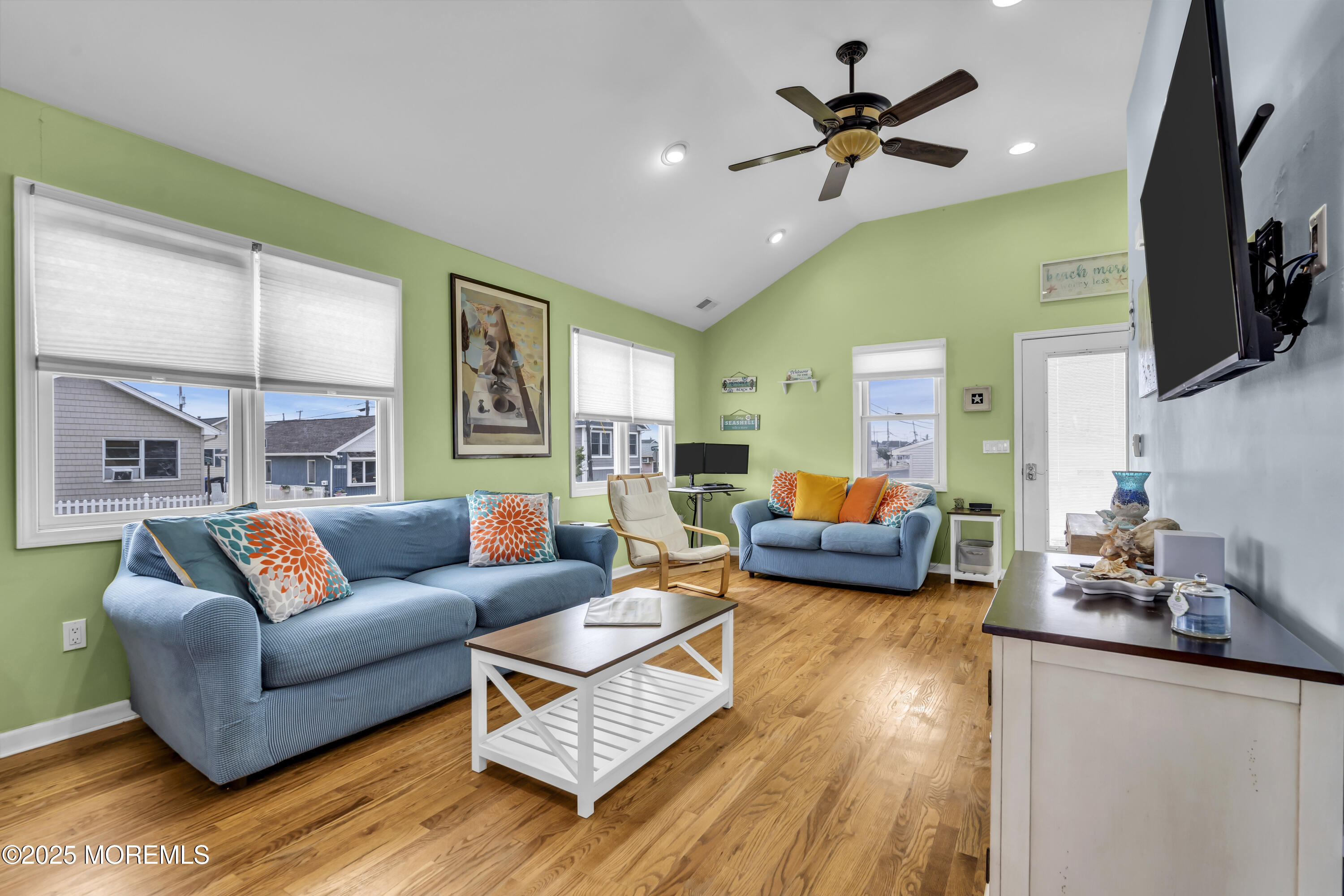 39 East Penguin Way Lavallette, NJ 08735 - Photo 9 of 29 a living room with furniture flat screen tv and a chandelier