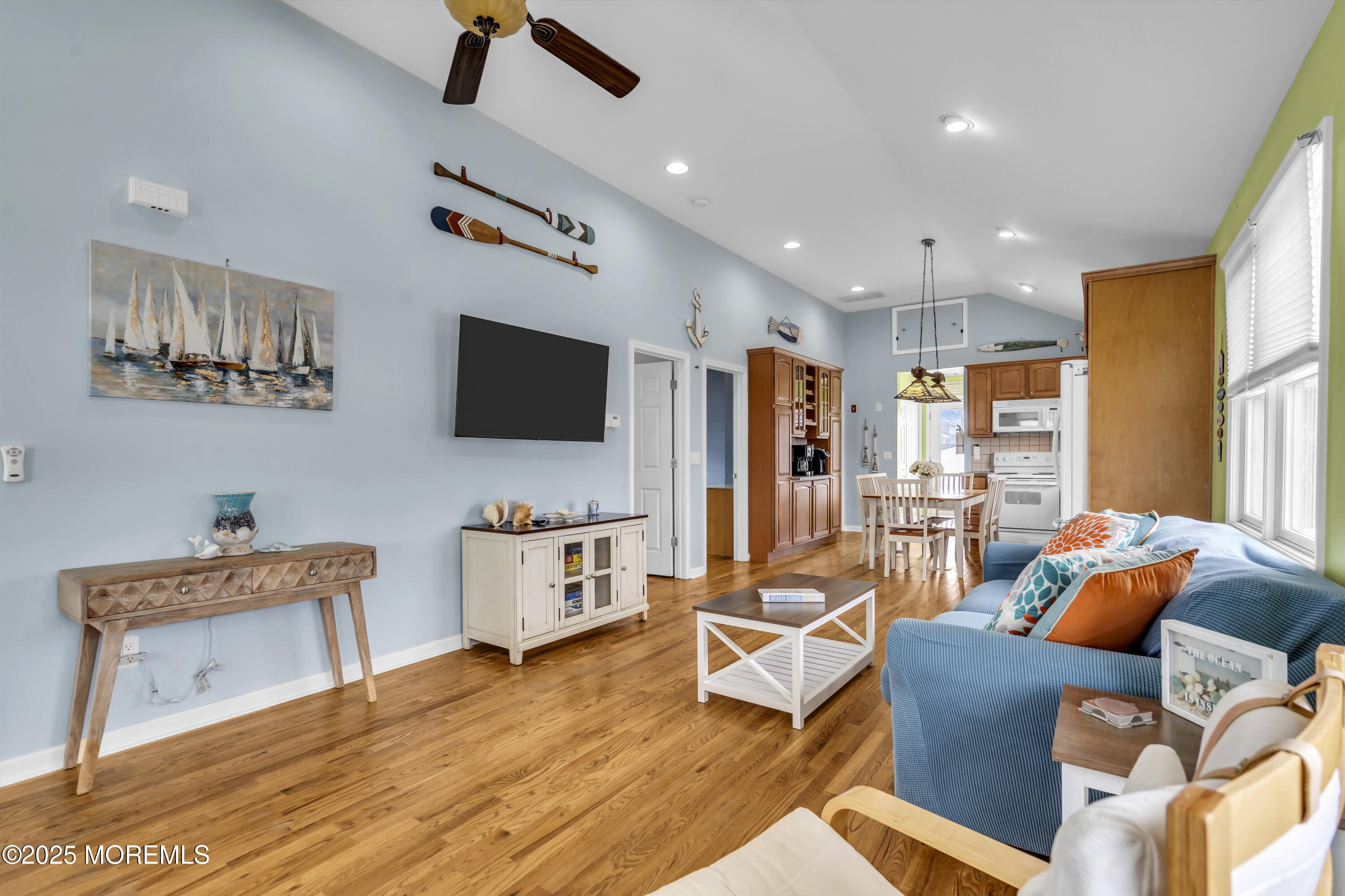 39 East Penguin Way Lavallette, NJ 08735 - Photo 10 of 29 a living room with furniture a flat screen tv and kitchen view