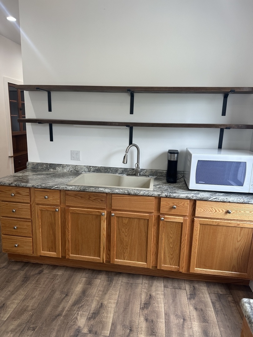8634 South Carpenter Street Chicago, IL 60620 - Photo 11 of 28 a kitchen with granite countertop a sink and cabinets