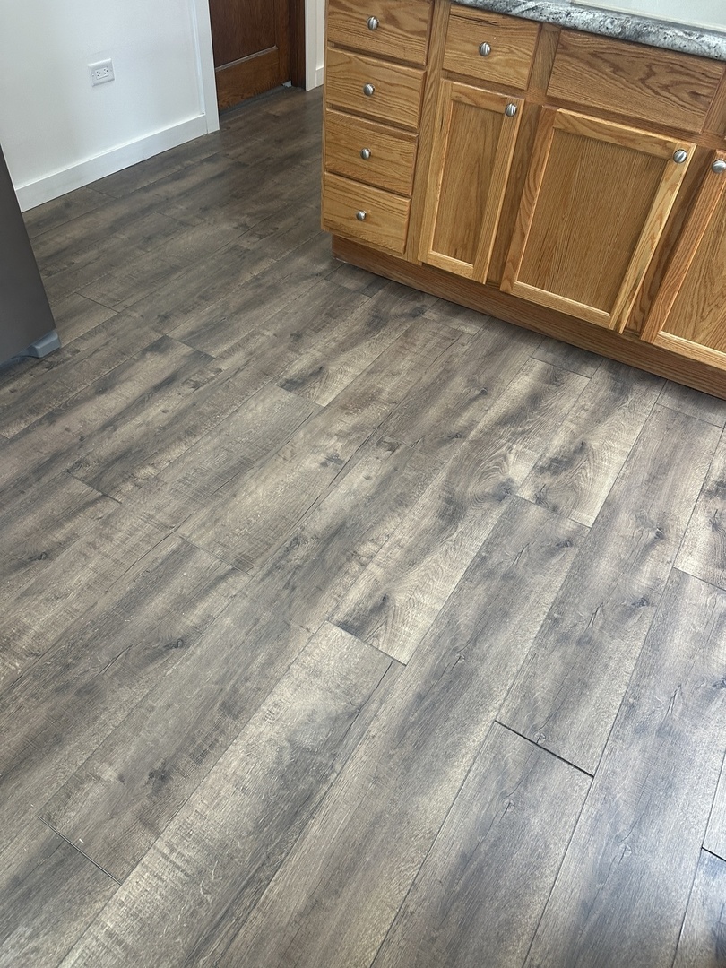8634 South Carpenter Street Chicago, IL 60620 - Photo 13 of 28 a view of a dresser with wooden cabinets