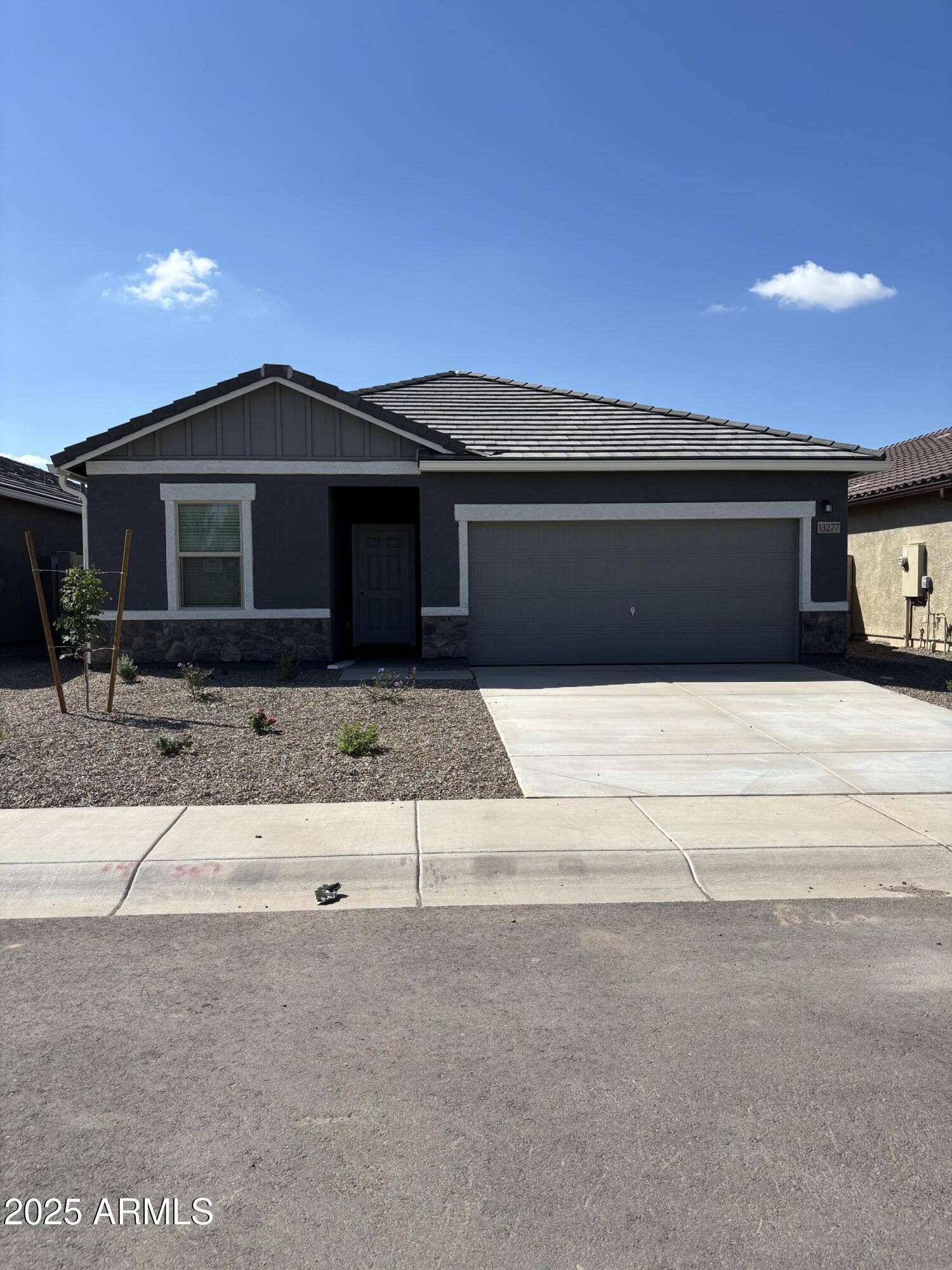13277 East Wallflower Lane Florence, AZ 85132 - Photo 2 of 11 a front view of a house