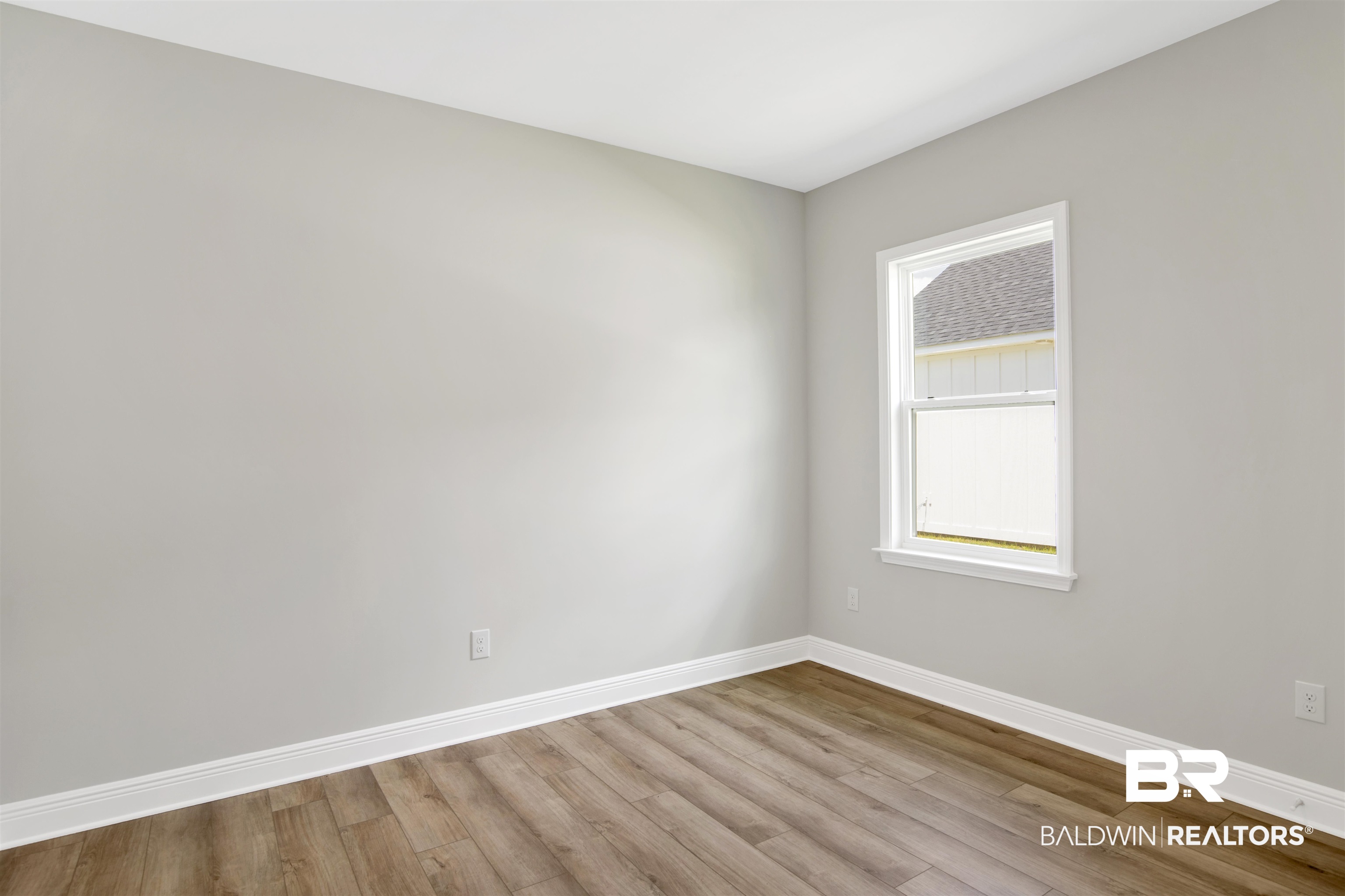 23852 Lafite Circle Daphne, AL 36526 - Photo 23 of 30 Empty room featuring baseboards and wood finished floors