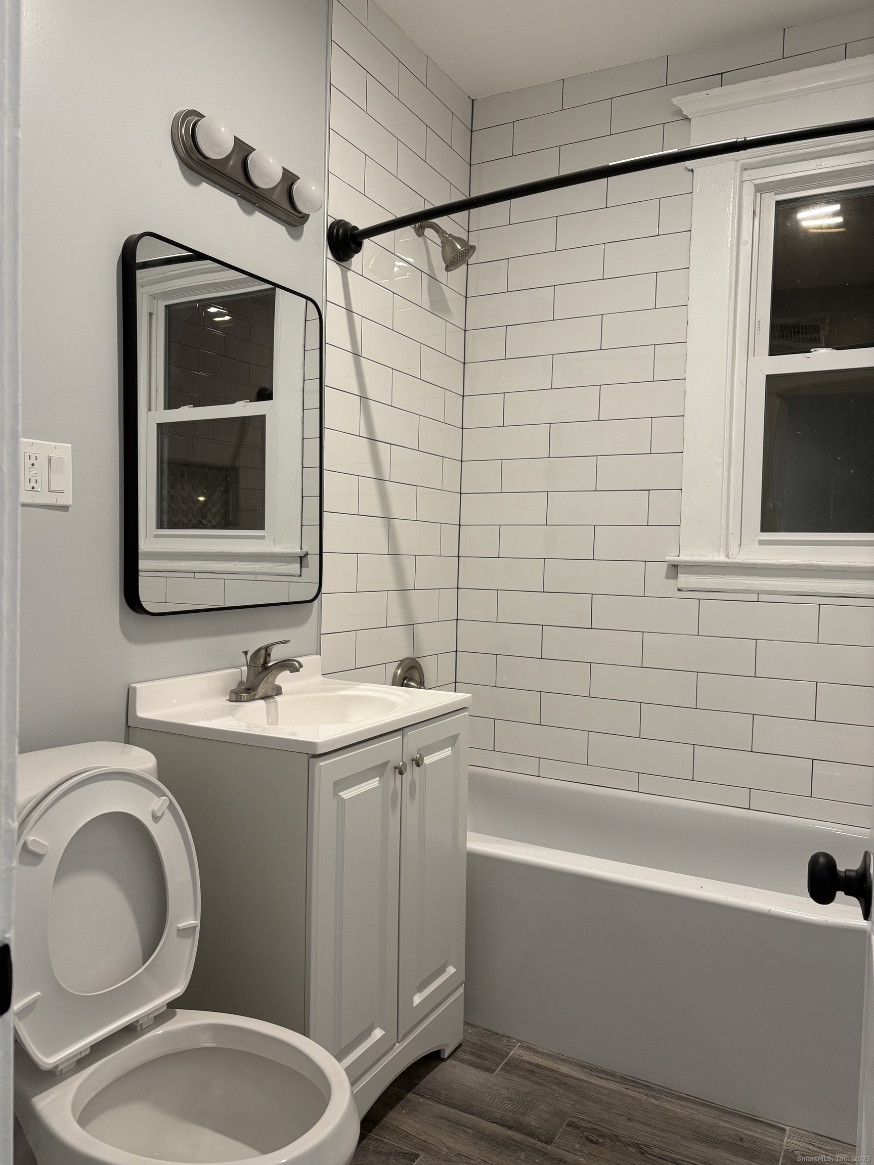 72 4th Street, Unit 1 New Haven, CT 06519 - Photo 11 of 16 a bathroom with a toilet sink and mirror