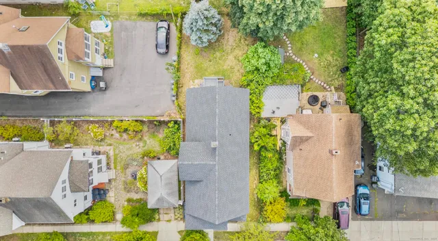 an aerial view of residential house with outdoor space and swimming pool
