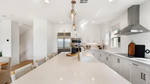 a kitchen with counter top space cabinets and stainless steel appliances