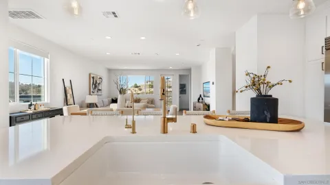 a view of kitchen with dining table and chairs