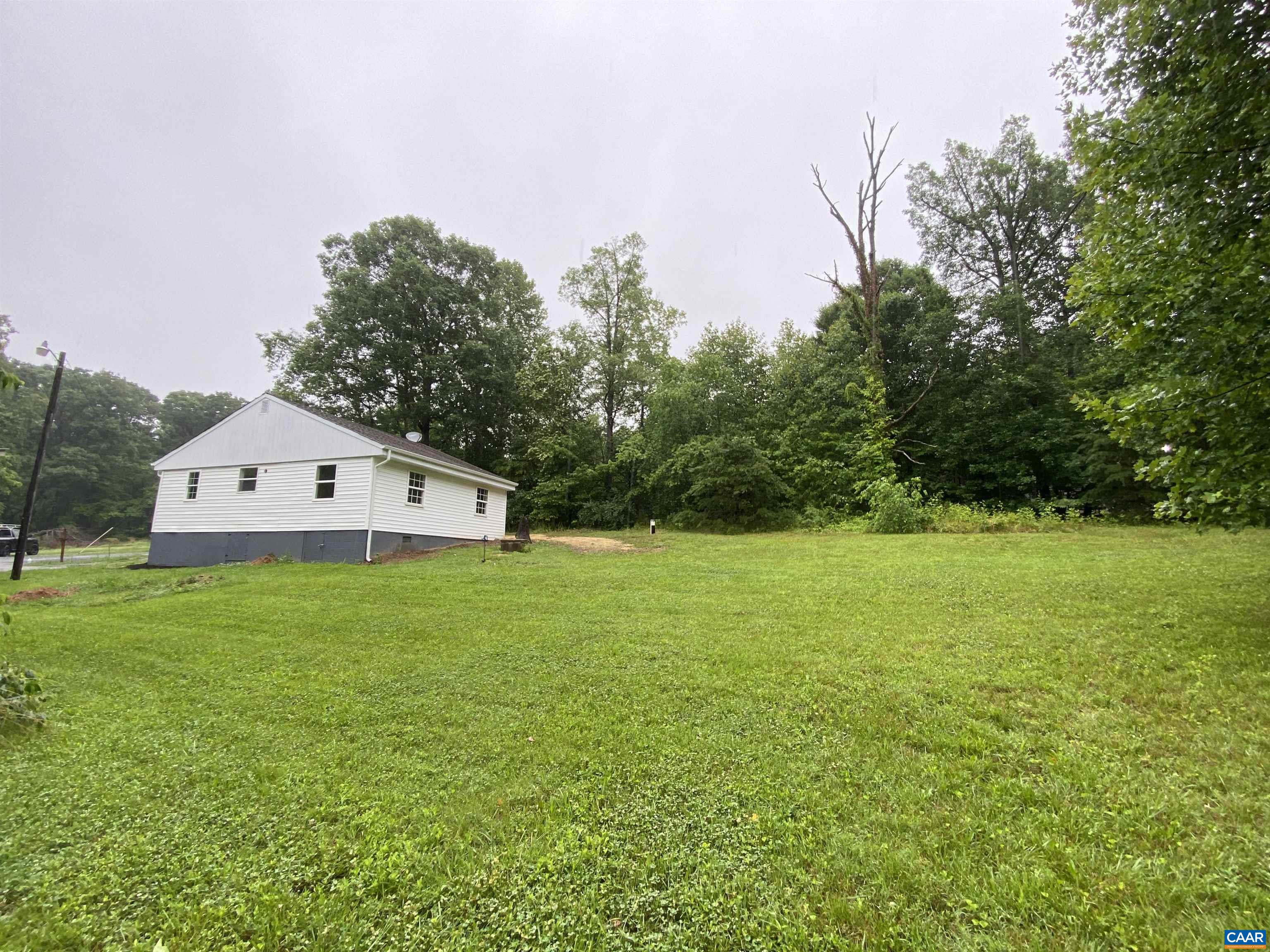 193 Rock Road New Canton, VA 23123 - Photo 11 of 12 a view of a house with a yard