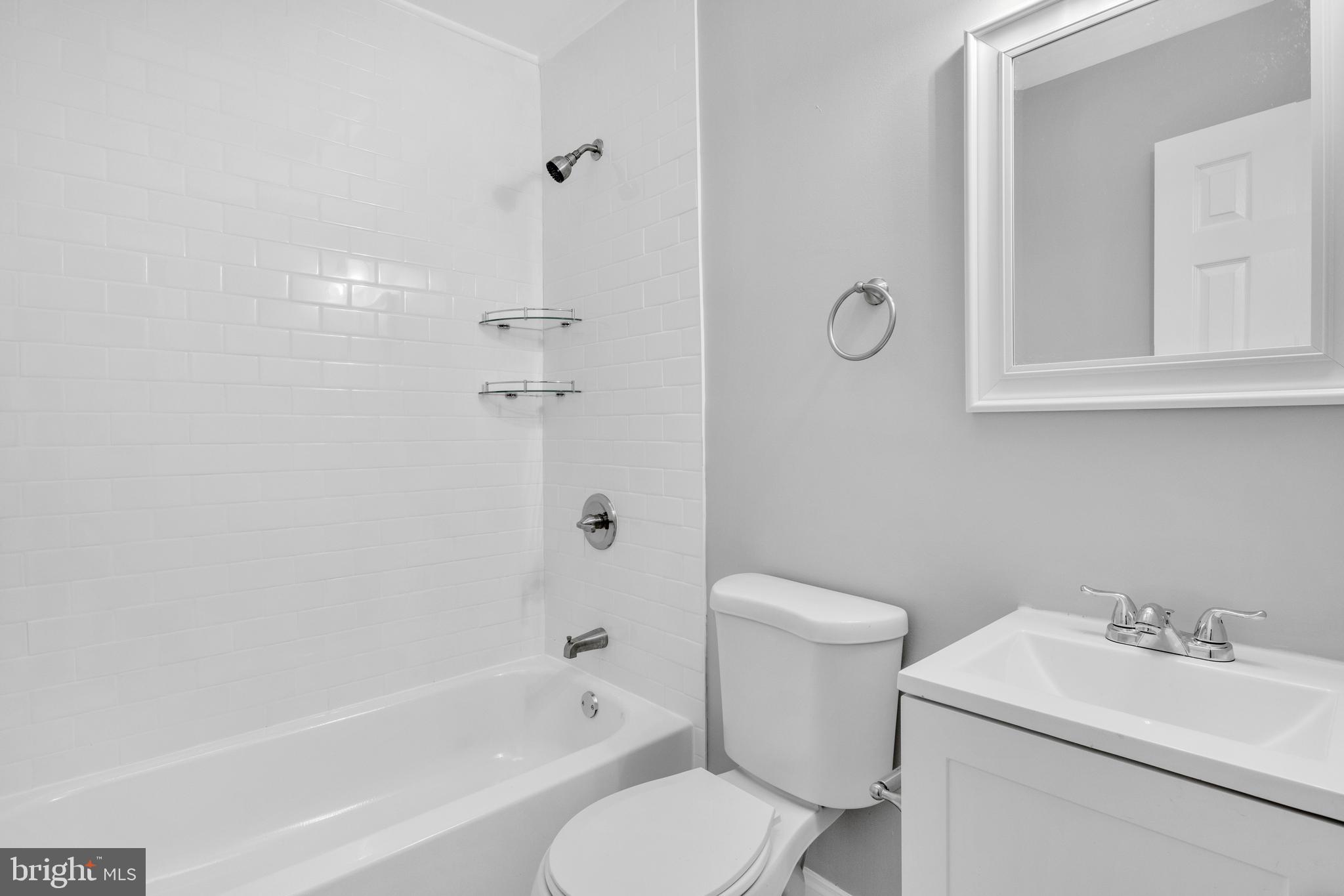 3606 Manchester Avenue Baltimore, MD 21215 - Photo 11 of 21 a bathroom with a sink toilet and shower