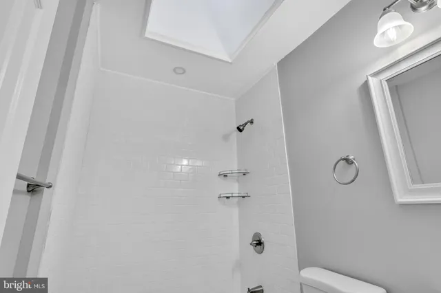 a picture of a bench in front of a building