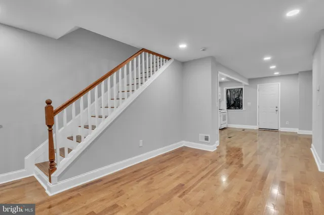 a view of an entryway with wooden floor