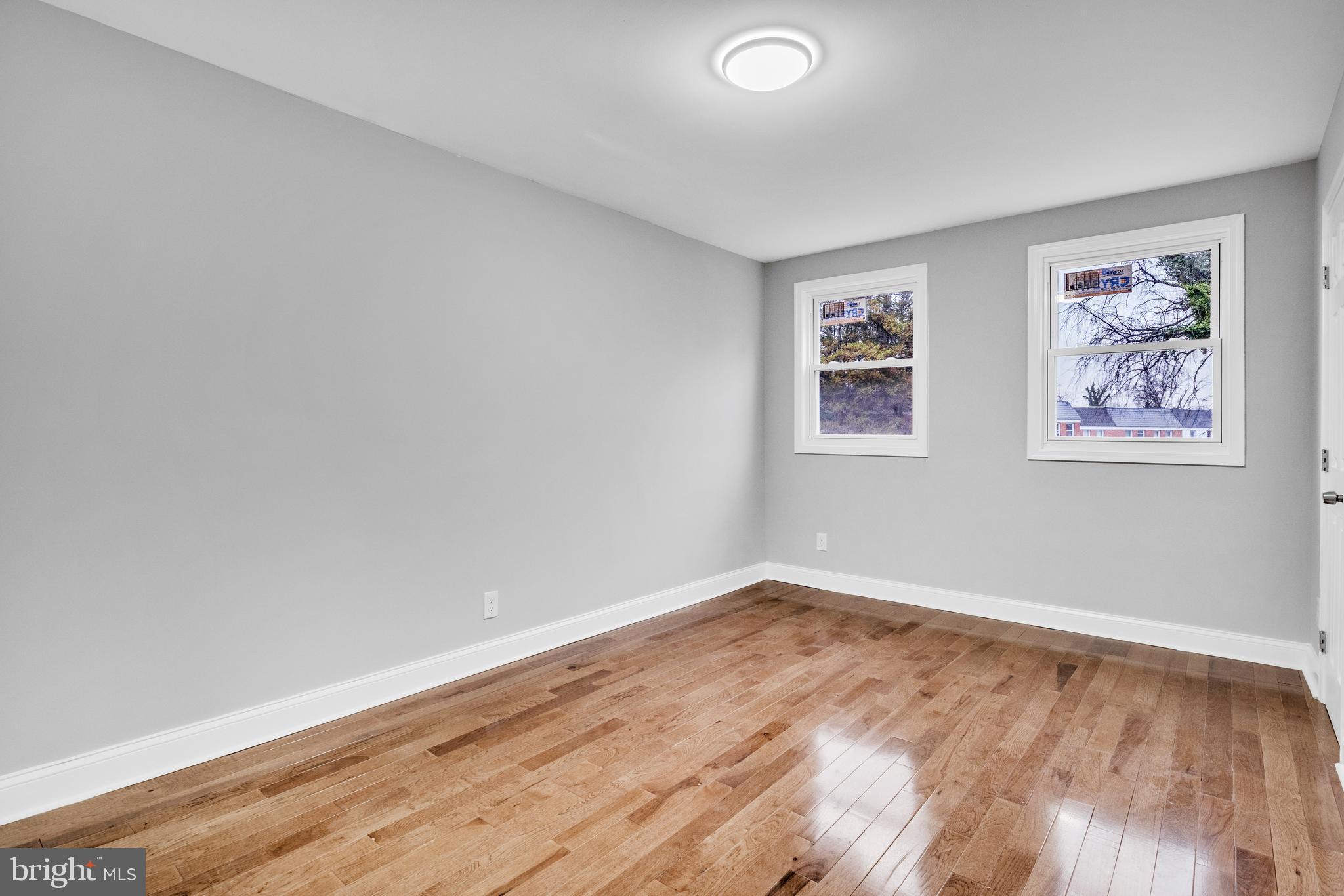 3606 Manchester Avenue Baltimore, MD 21215 - Photo 9 of 21 a view of room with window and wooden floor