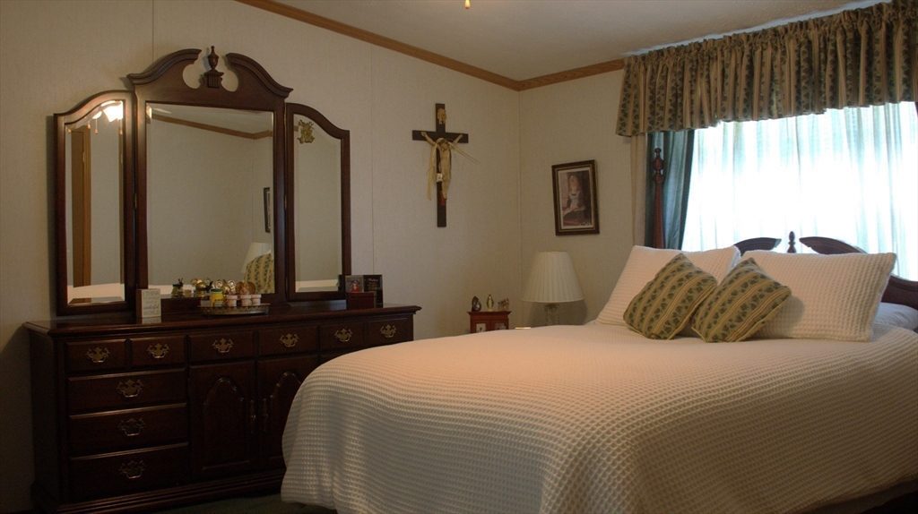 20 Deer Run Brookfield, MA 01506 - Photo 15 of 29 a bedroom with a bed and a mirror
