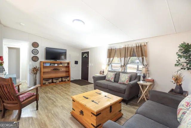 a bathroom with a sink a mirror and a shower