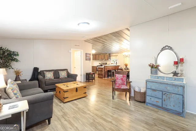 a bathroom with a sink toilet vanity and mirror