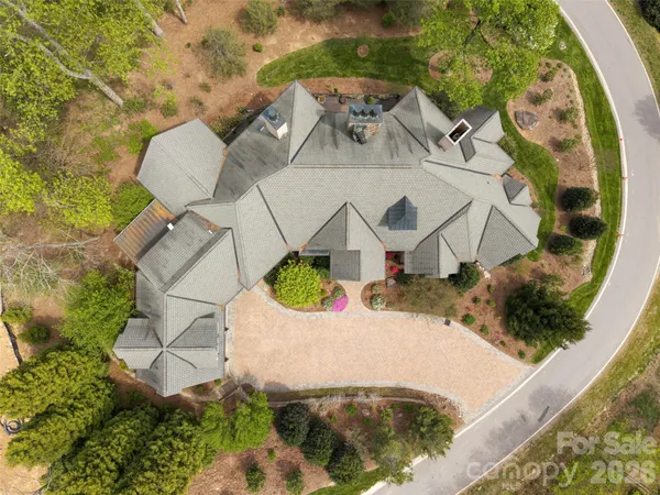 an aerial view of a house with swimming pool